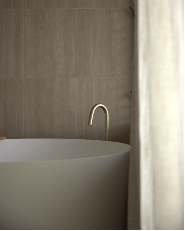 Renovated bathroom — Builders World Beautifully renovated modern bathroom with freestanding bath and soft neutral finishes — Builders World
