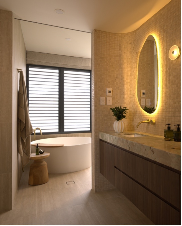 Walk-in shower renovation Walk-in shower with frameless glass and feature tiling in a modern bathroom layout
