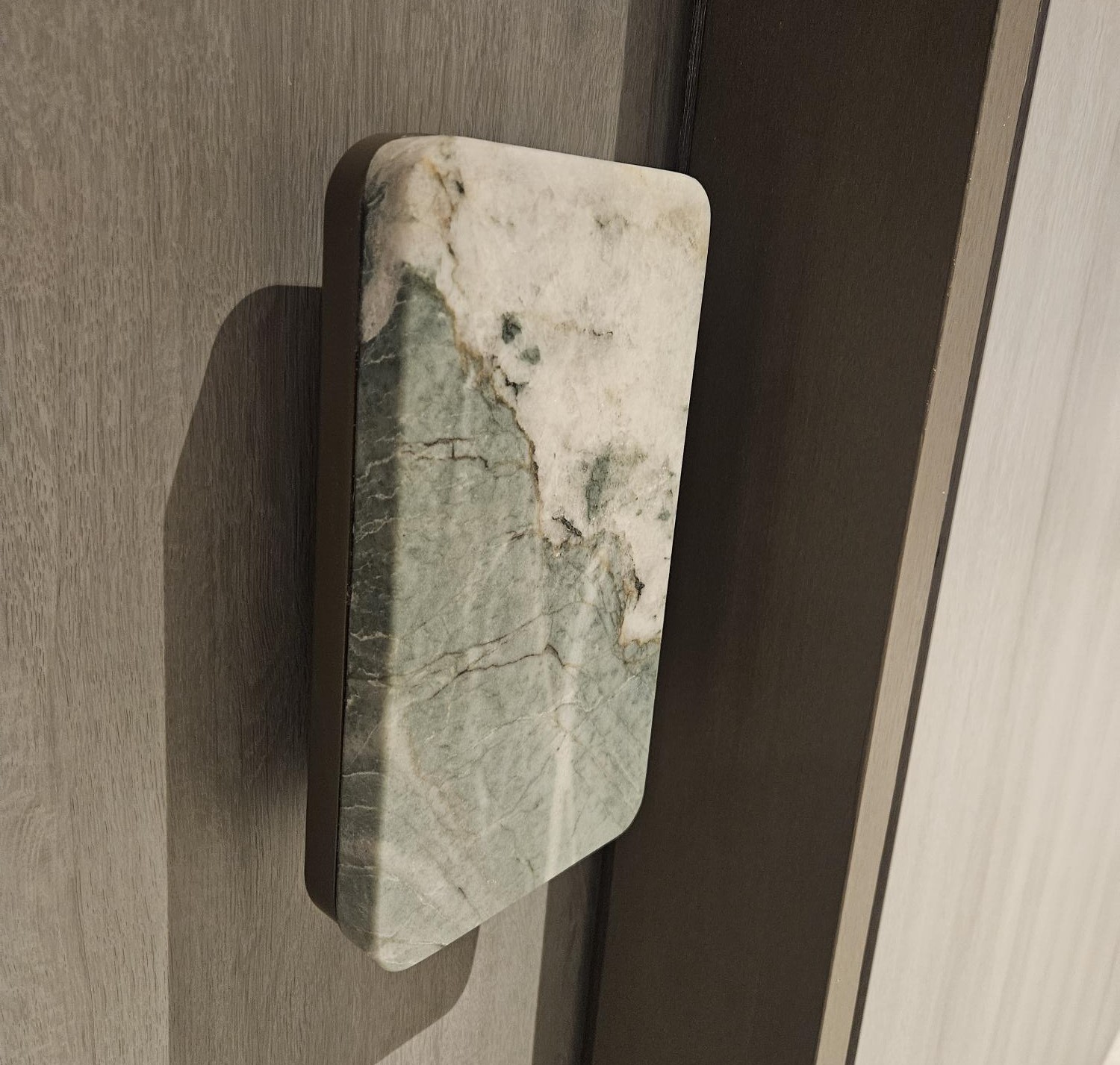 The finished stone pull, fitted on a timber door